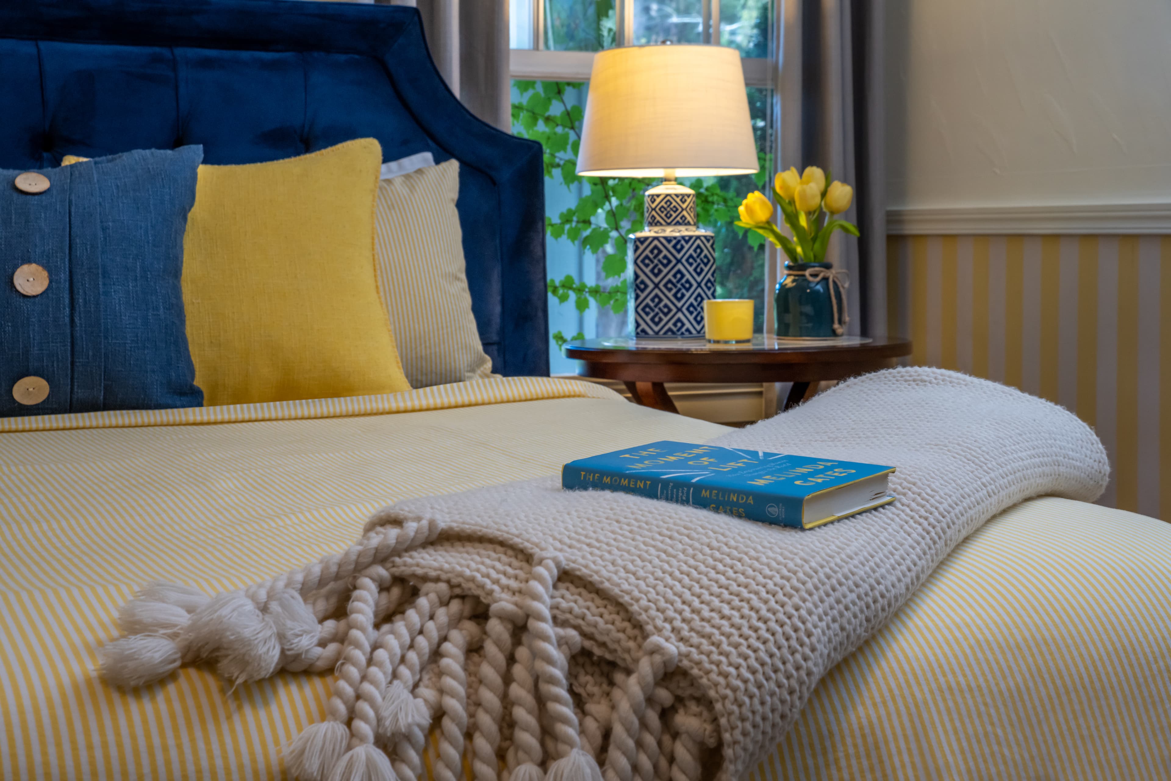 Swedish Room throw blanket and book on bed